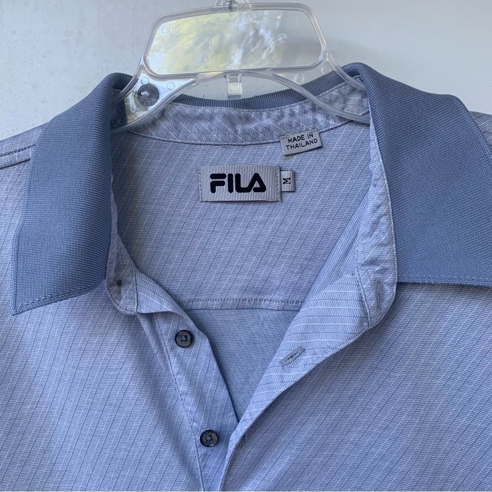 FILA.‎ Men's Blue short sleeve shirt. Size M. 100% Cotton. Logo on Sleeve.